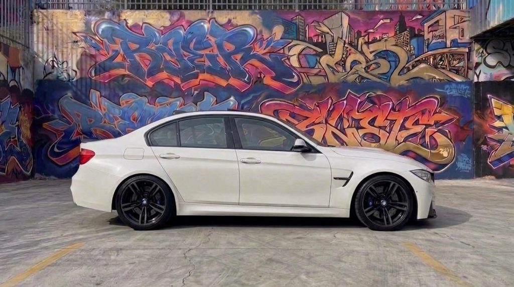 White 2016 BMW M3 Competition F80 Stage 1, side profile, available for hire in Sydney