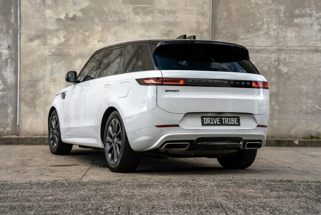 White 2023 Land Rover Range Rover Sport, rear three-quarter view, available for hire in Sydney