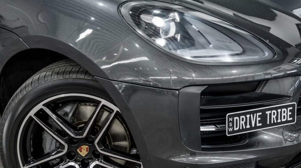 Headlight of the grey 2019 Porsche Macan, available for hire in Sydney