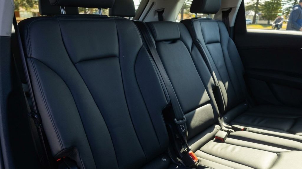 Rear seats of the white 2021 Audi Q7 45 TDI quattro, available for hire in Sydney