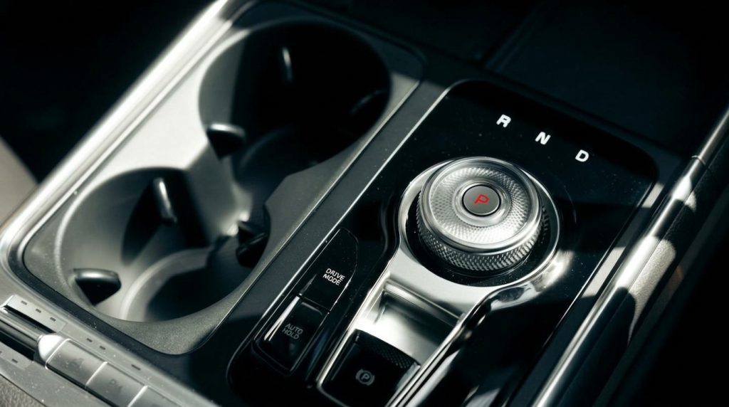 Gear selector of the black 2025 Kia Carnival GT-Line Hybrid, available for hire in Sydney