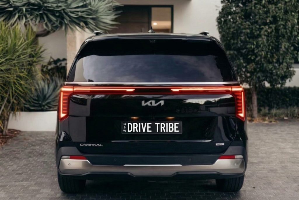 Black 2025 Kia Carnival GT-Line Hybrid, rear view, available for hire in Sydney