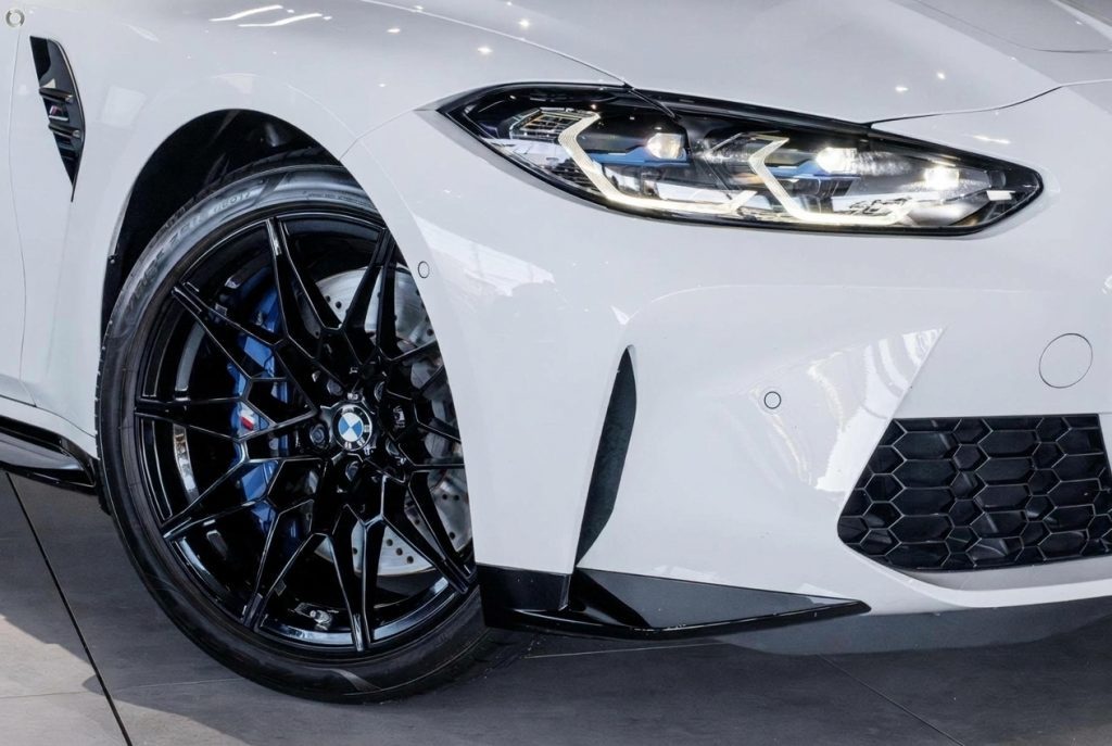 Wheel of the white 2024 BMW M3 Competition G80 xDrive, available for hire in Sydney