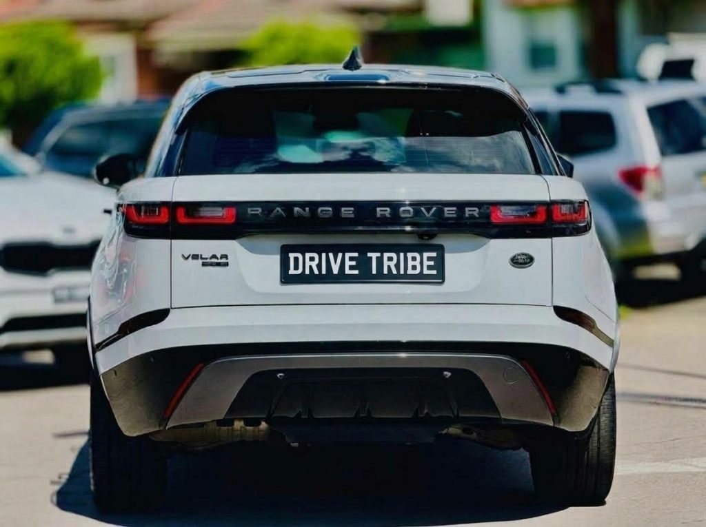 White 2018 Land Rover Range Rover Velar, rear view, available for hire in Sydney
