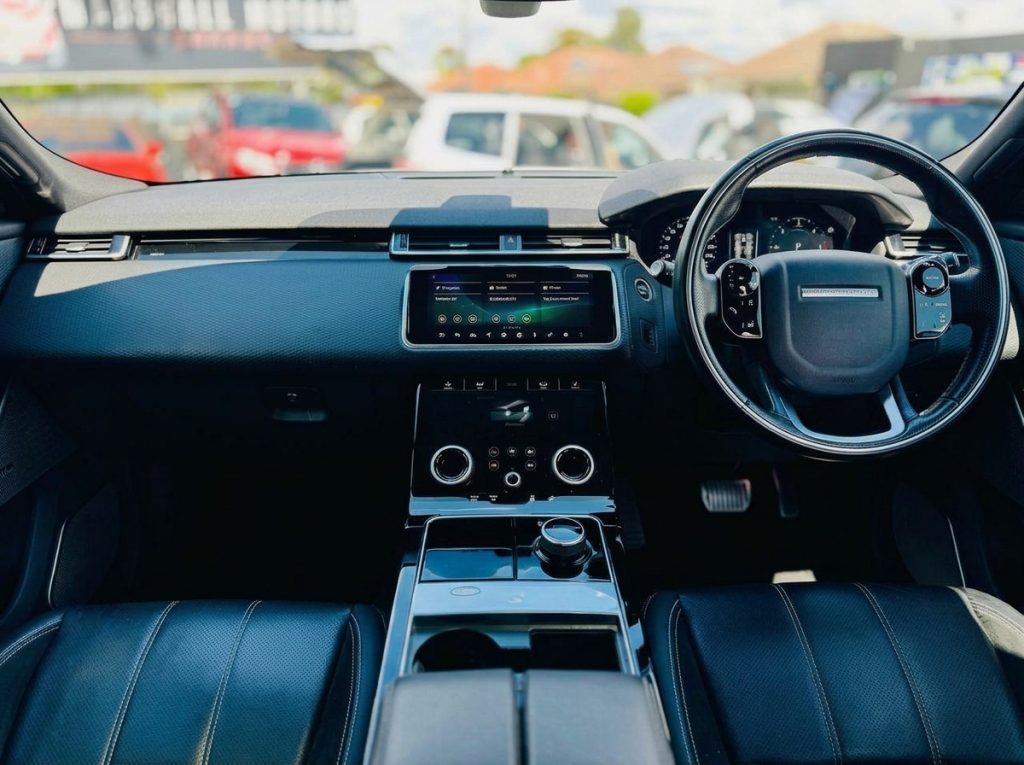 Dashboard of the white 2018 Land Rover Range Rover Velar, available for hire in Sydney