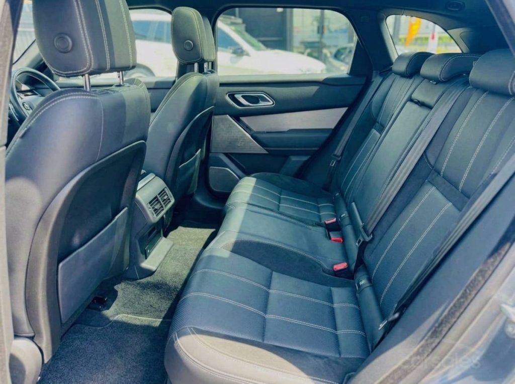 Rear seats of the white 2018 Land Rover Range Rover Velar, available for hire in Sydney