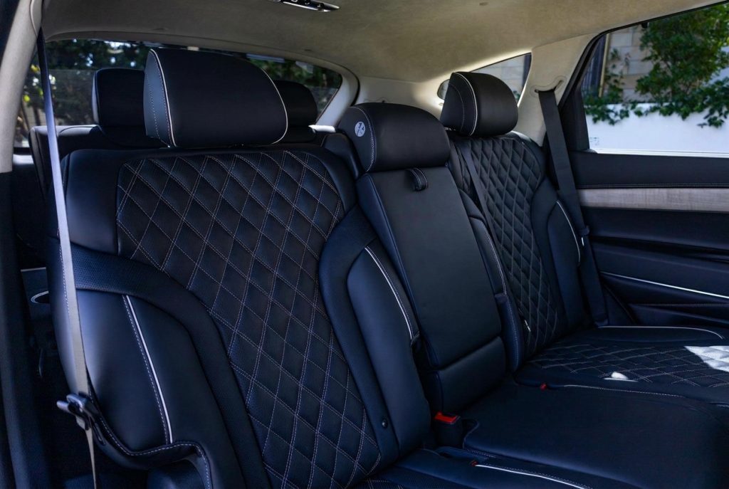 Rear seats of the grey 2023 Genesis GV80 3.0D Lux 7-Seat, available for hire in Sydney