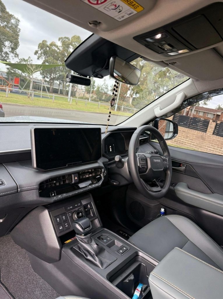 Dashboard of the silver 2026 Toyota HiLux Rogue 4x4, available for hire in Sydney