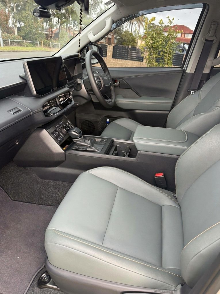 Front seats of the silver 2026 Toyota HiLux Rogue 4x4, available for hire in Sydney