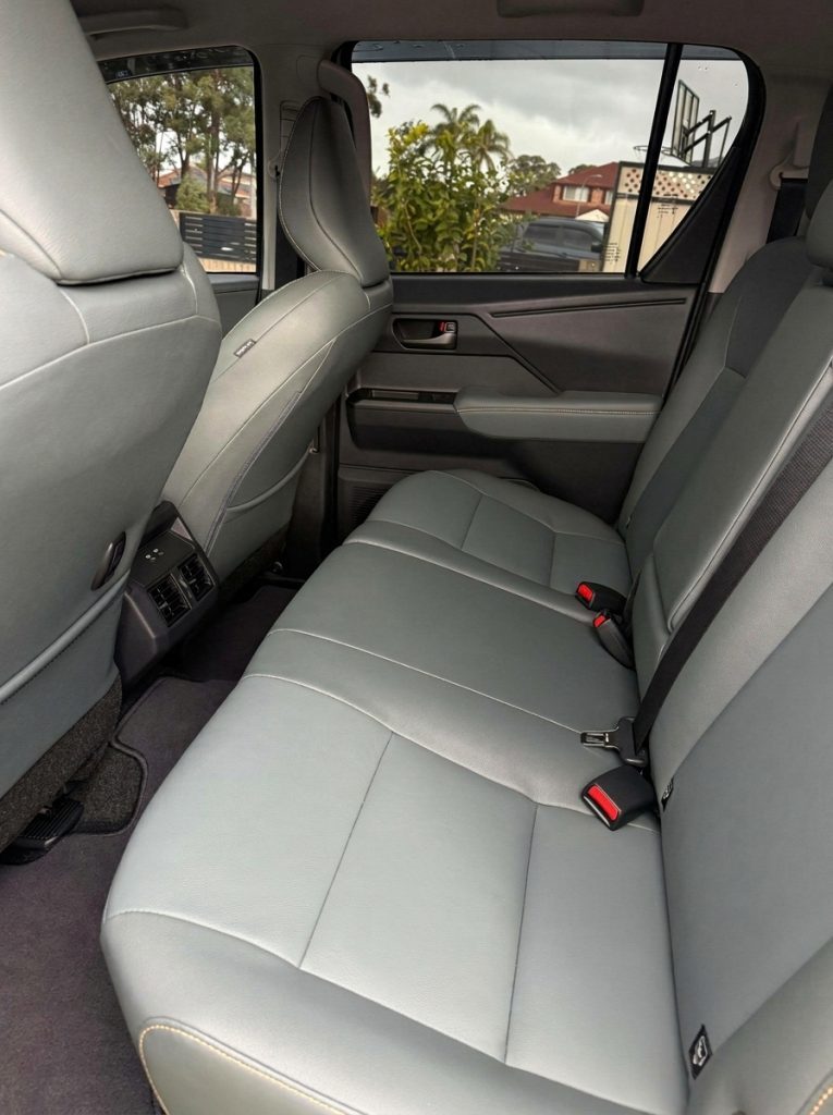 Rear seats of the silver 2026 Toyota HiLux Rogue 4x4, available for hire in Sydney