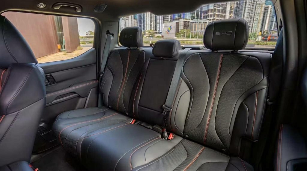 Rear seats of the black 2026 BYD Shark 6 Premium, available for hire in Sydney