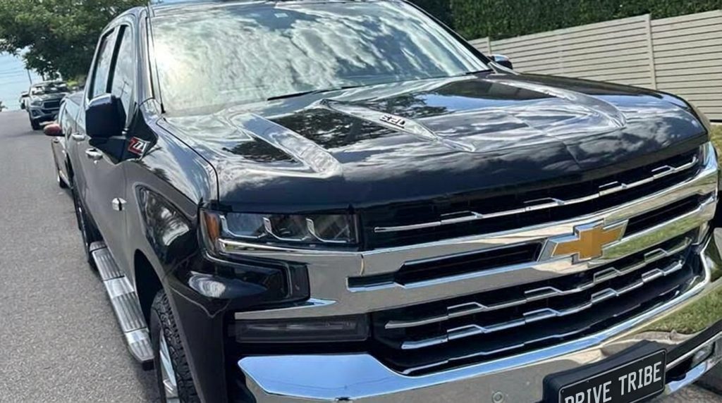 Black 2022 Chevrolet Silverado 1500 Trail Boss, front three-quarter view, available for hire in Sydney