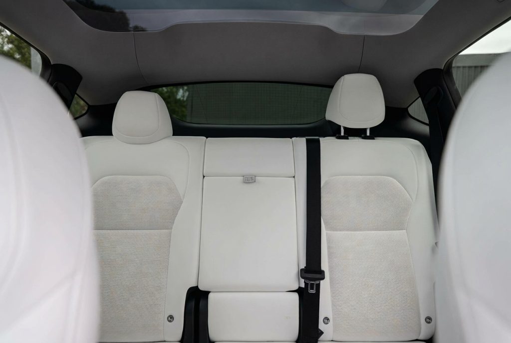 Rear seats of the silver 2025 Tesla Model Y RWD, available for hire in Sydney