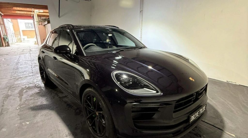 Black 2024 Porsche Macan GTS, front three-quarter view, available for hire in Sydney