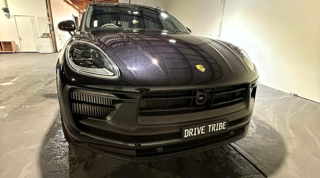 Black 2024 Porsche Macan GTS, front three-quarter view, available for hire in Sydney