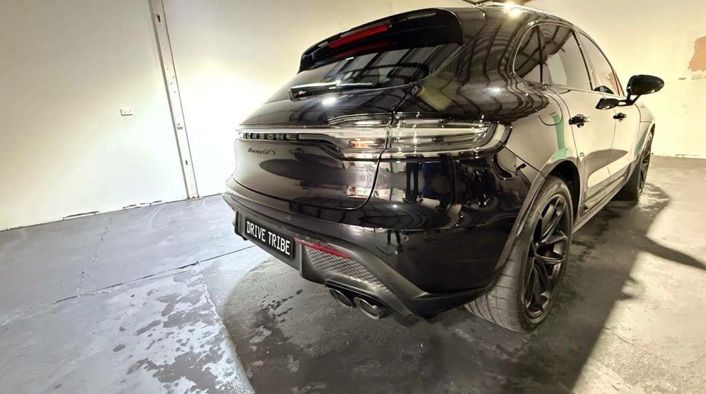Black 2024 Porsche Macan GTS, rear three-quarter view, available for hire in Sydney