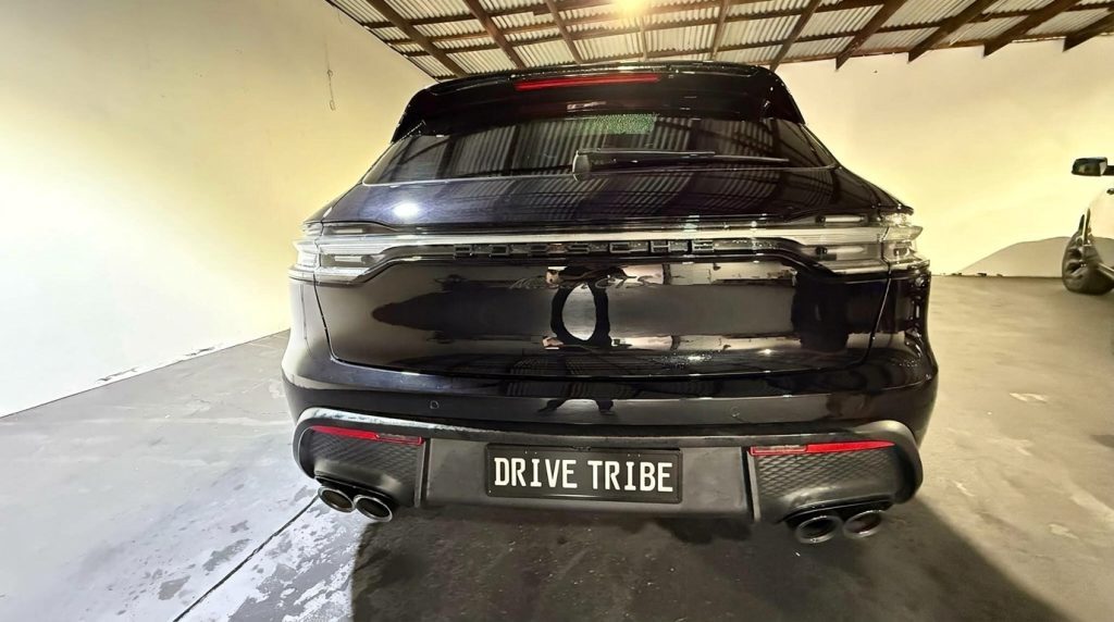 Black 2024 Porsche Macan GTS, rear view, available for hire in Sydney