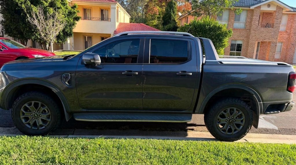 Grey 2022 Ford Ranger Wildtrak 4x4, side profile, available for hire in Sydney