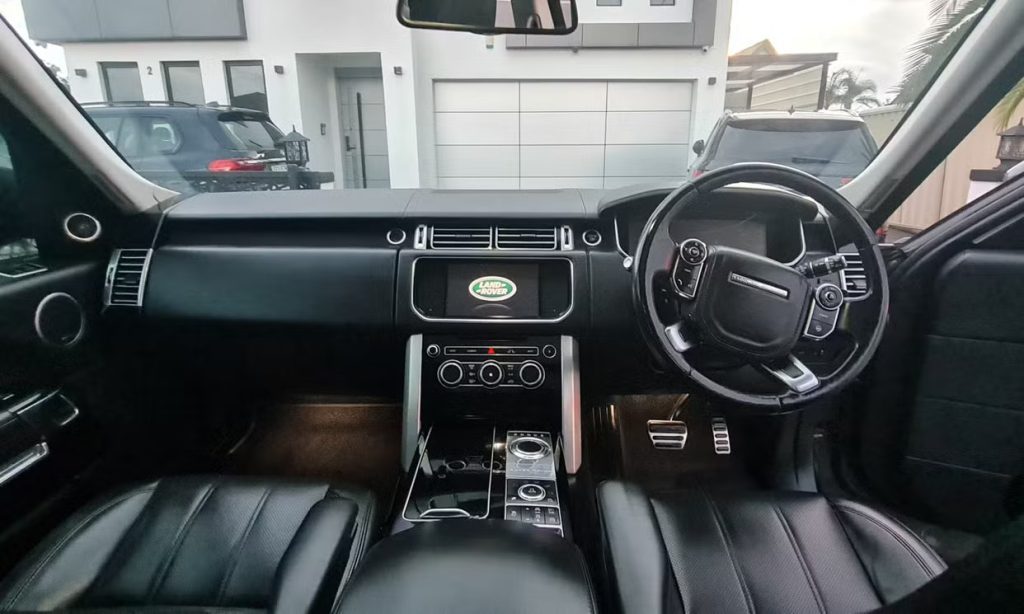 Dashboard of the grey 2013 Land Rover Range Rover Vogue, available for hire in Sydney